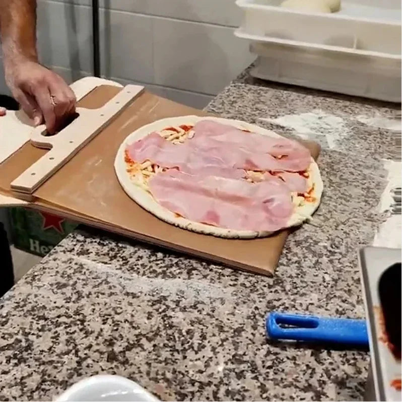 Sliding pizza peel with foldable handle